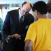 Christopher Cartwright, of Lawrence Technological University, shows off a controller to students during Michigan Robotics Day at the Jack Roth Stadium Club at Michigan Stadium on Monday, April 15, 2013. Melanie Maxwell I AnnArbor.com